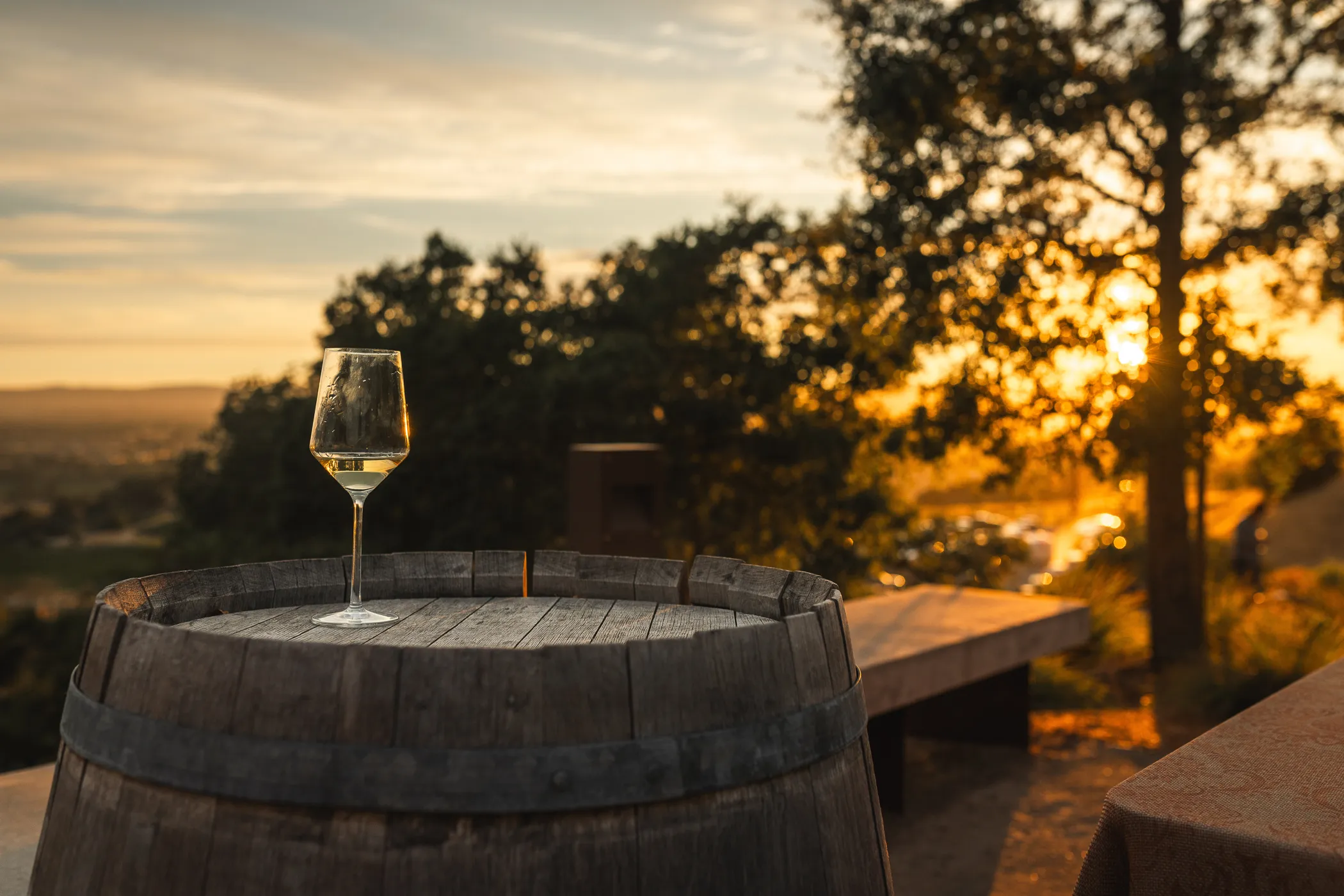 SunsetSoirree-86 Glass of wine atop a barrel at sunset