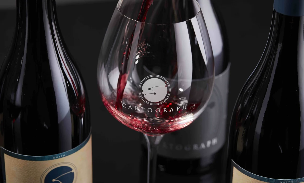 Bottle and glass of Cartograph wine