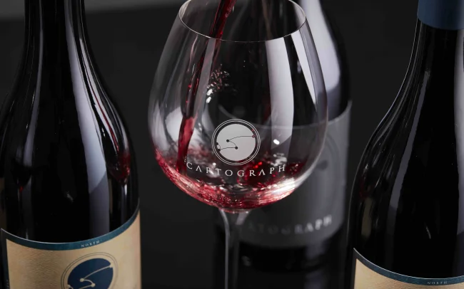 Bottle and glass of Cartograph wine